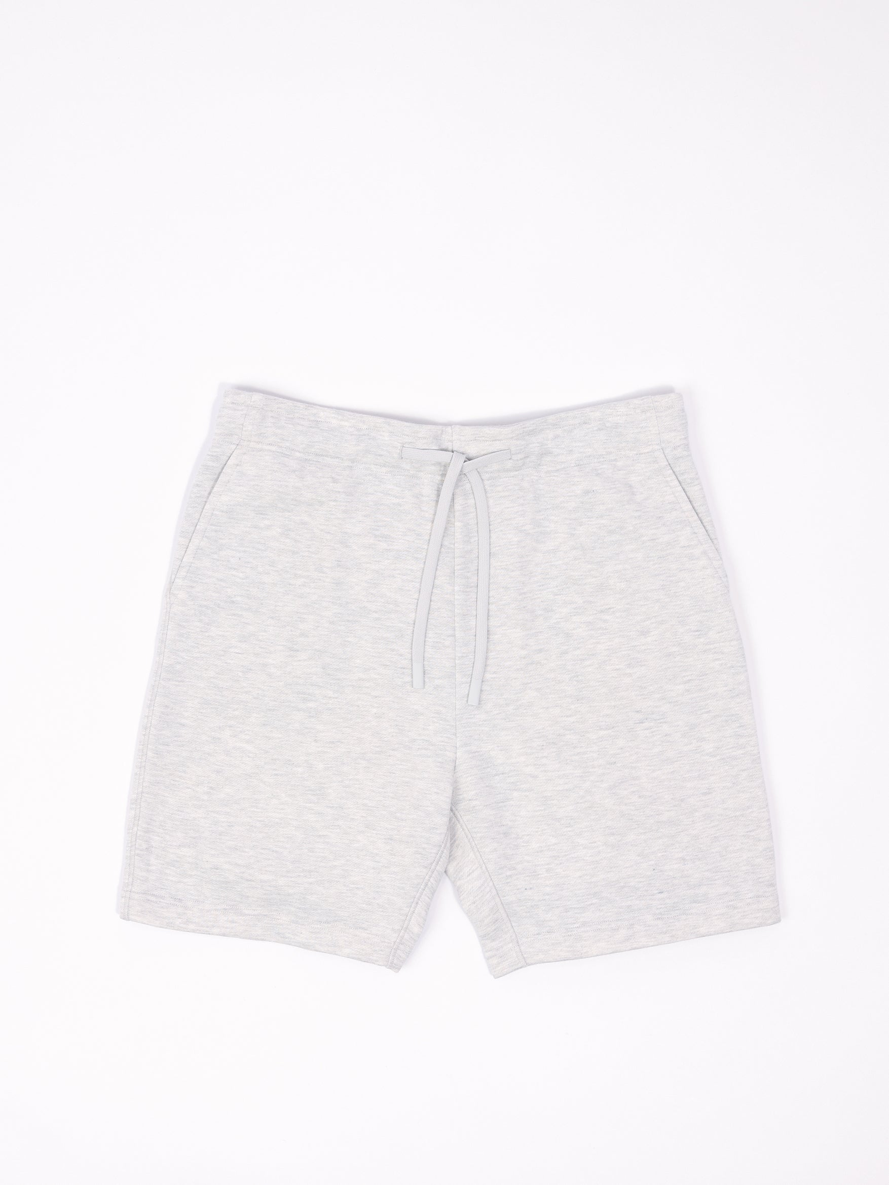 Flat lay of heather grey cityscape shorts with white background 