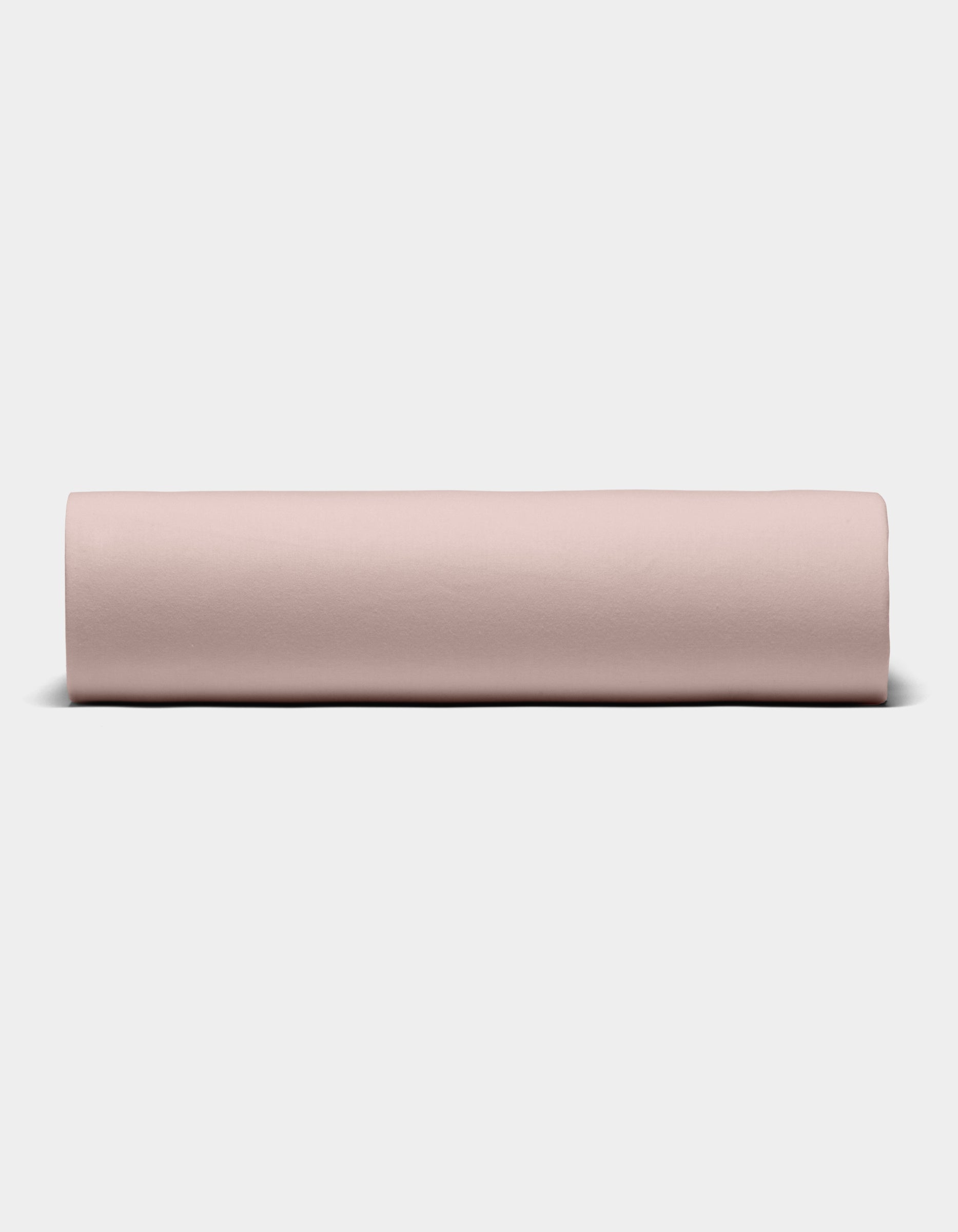 The Cozy Earth Bamboo Jersey Sheet Set is shown rolled into a neat cylinder, displayed from the front against a plain white background.