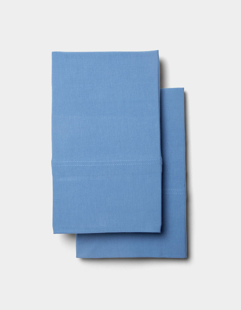 A pair of neatly folded Cozy Earth Bamboo Jersey Sheet Set linens stacked on a plain white background.