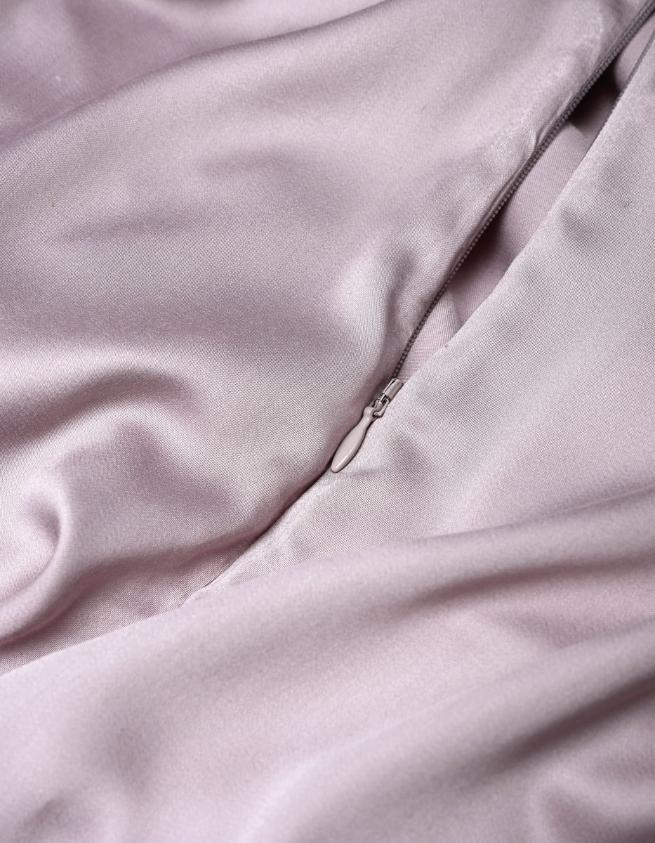 Close-up of the Cozy Earth Bamboo Duvet Cover in light pink, featuring a visible zipper that is partially unzipped to showcase the smooth and shiny satin-like texture of the fabric.