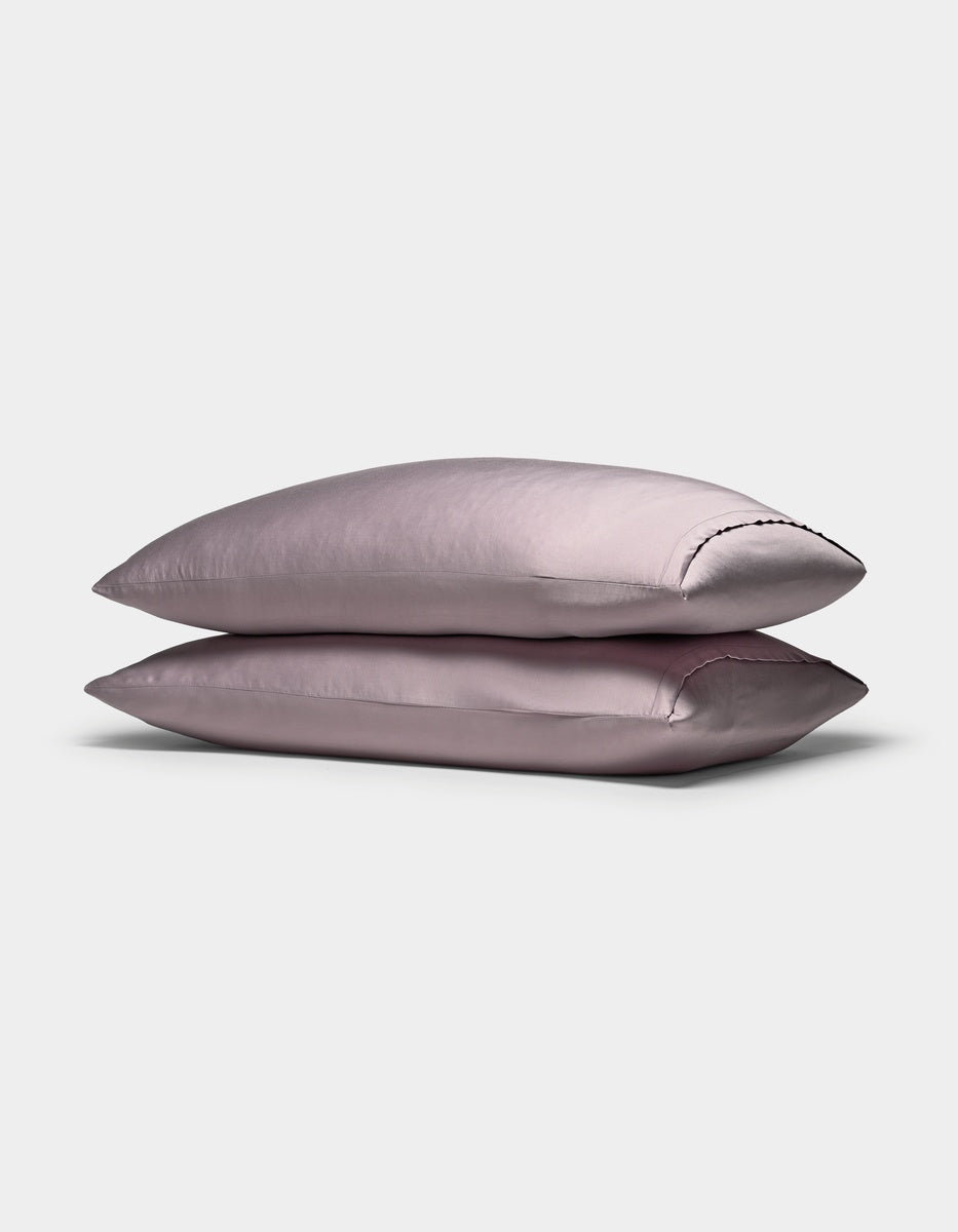 Two Cozy Earth Bamboo Pillowcases are stacked neatly on top of each other against a plain white background.
