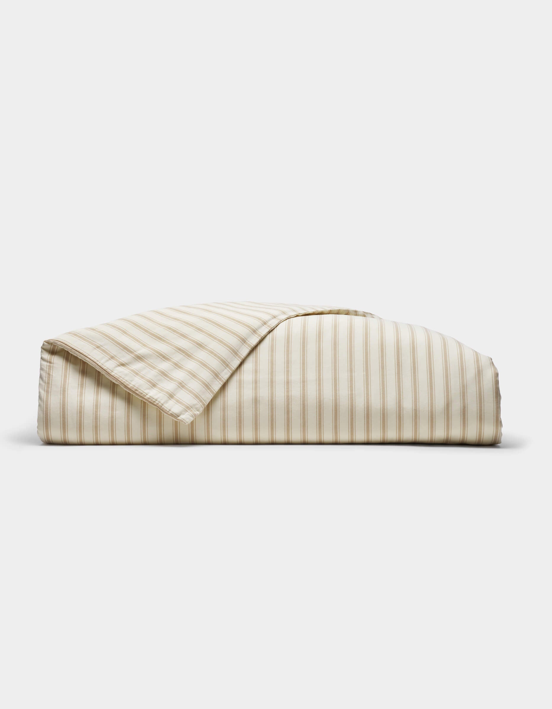 The Cozy Earth Soft-Wash Cotton Duvet Cover, featuring beige and white vertical stripes, is neatly folded and displayed against a plain white background.|Color:Coconut and Sandalwood Stripe