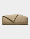The Cozy Earth Soft-Wash Cotton Duvet Cover is shown folded with a corner turned back, set against a plain white background.|Color:Sandalwood