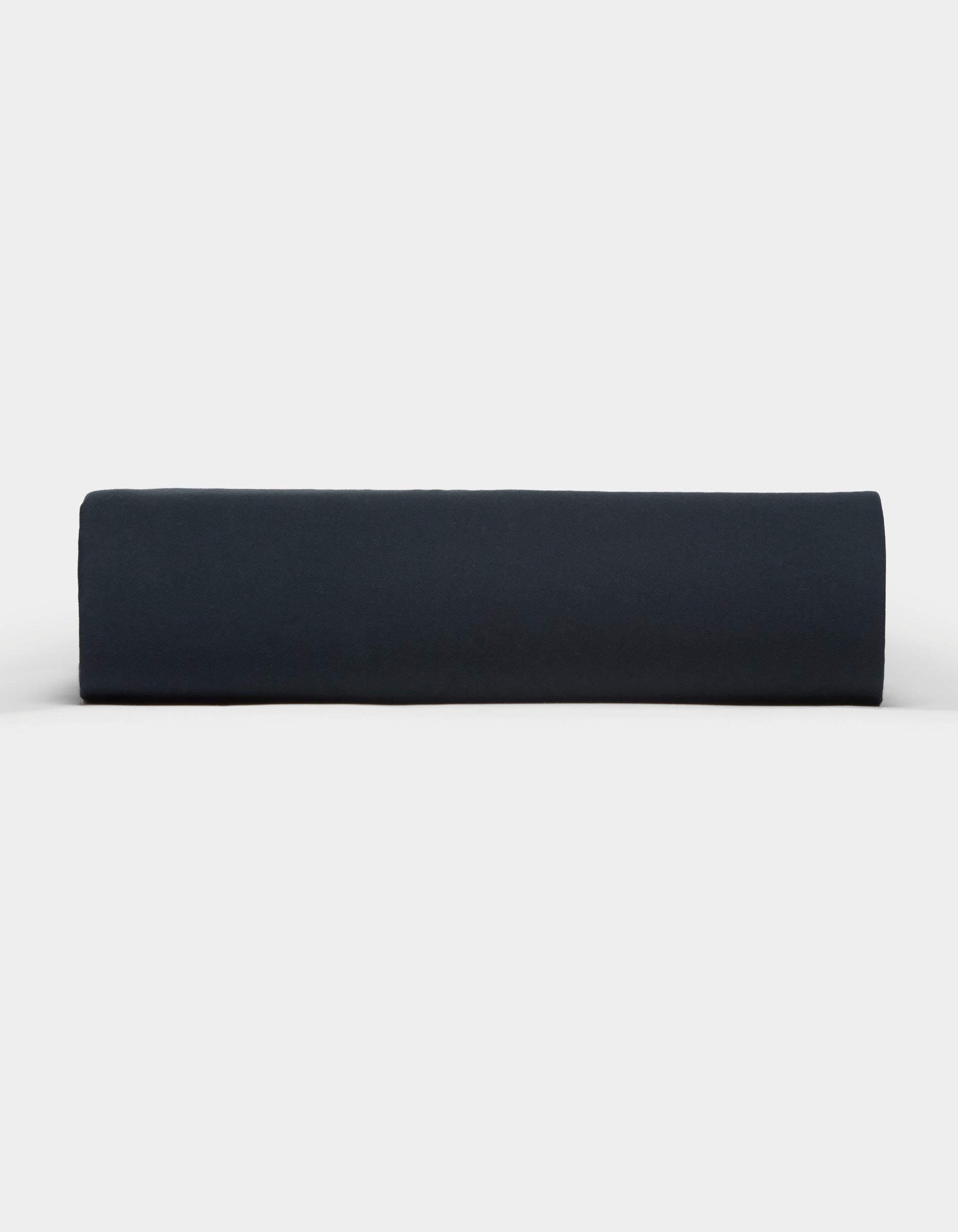 The Cozy Earth Soft-Wash Cotton Fitted Sheet in dark navy blue is neatly rolled and displayed from the side against a plain white background.|Color:Eclipse