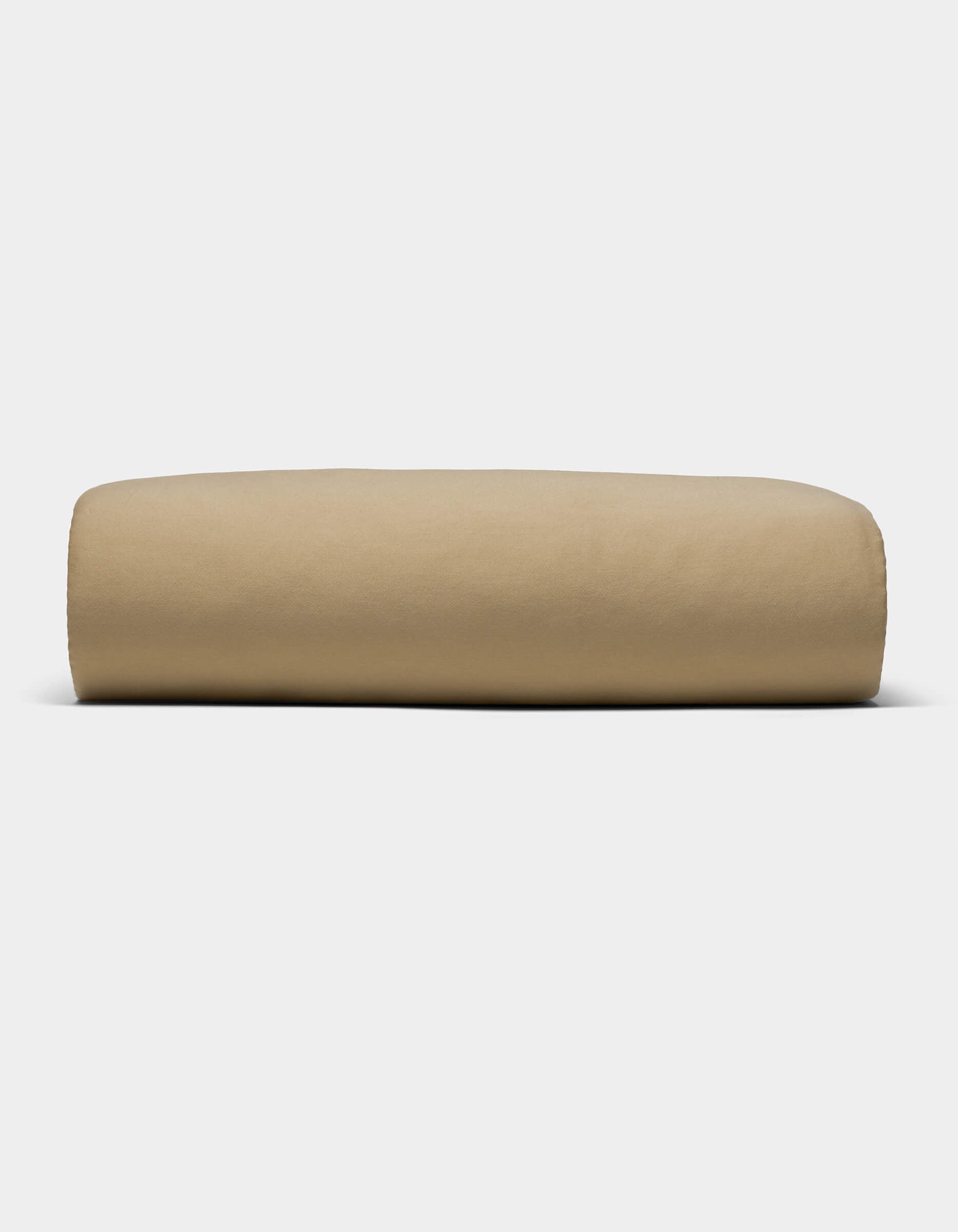 The Cozy Earth Soft-Wash Cotton Sheet Set, in a light brown shade, is shown neatly folded against a plain white background.|Color:Sandalwood