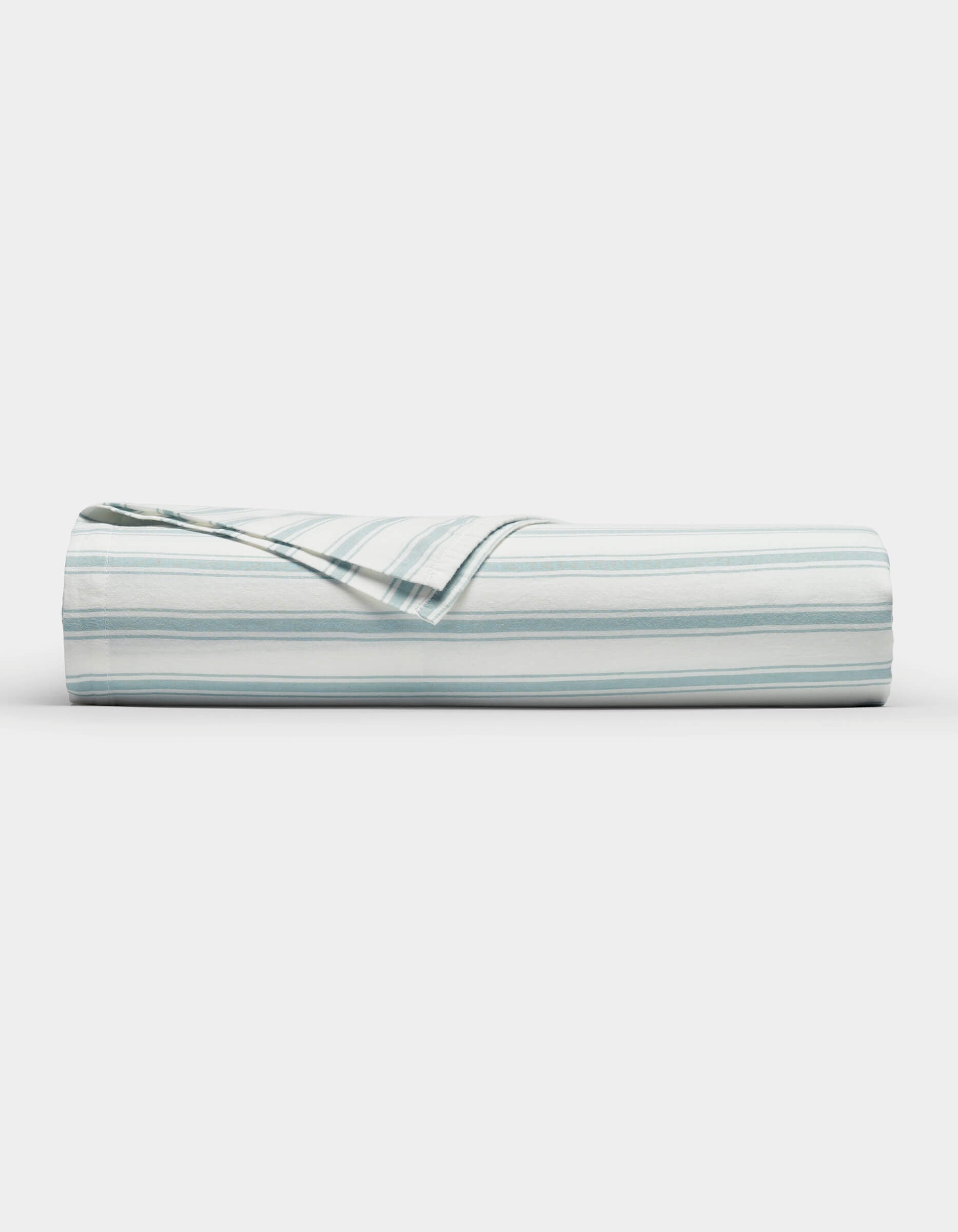 The Cozy Earth Soft-Wash Cotton Flat Sheet, featuring light blue and white horizontal stripes, is neatly folded and displayed against a plain white background.|Color:River and Sea Salt Stripe