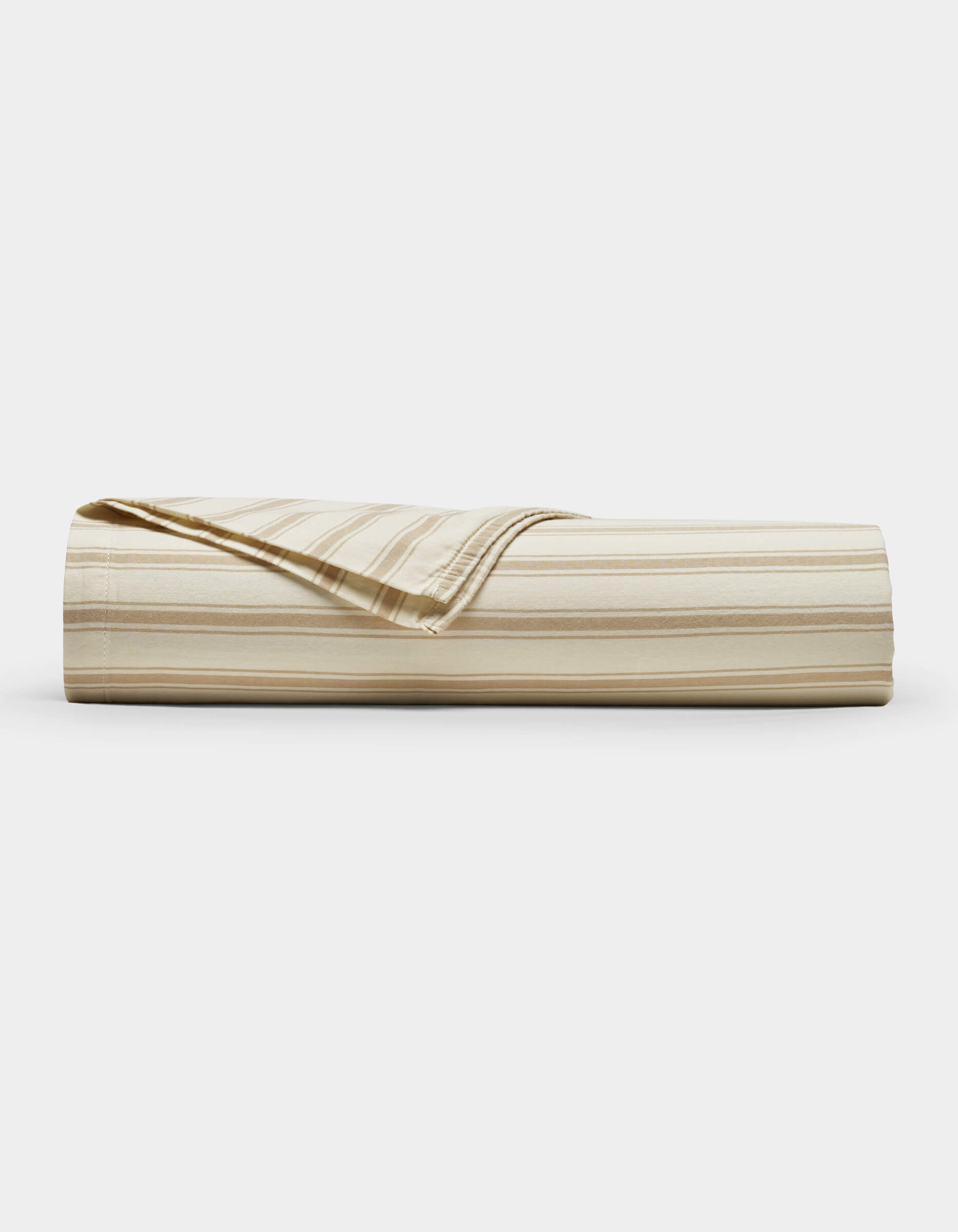 The Cozy Earth Soft-Wash Cotton Sheet Set, shown in beige and cream stripes, is neatly rolled with one corner folded back, displayed against a plain white background.