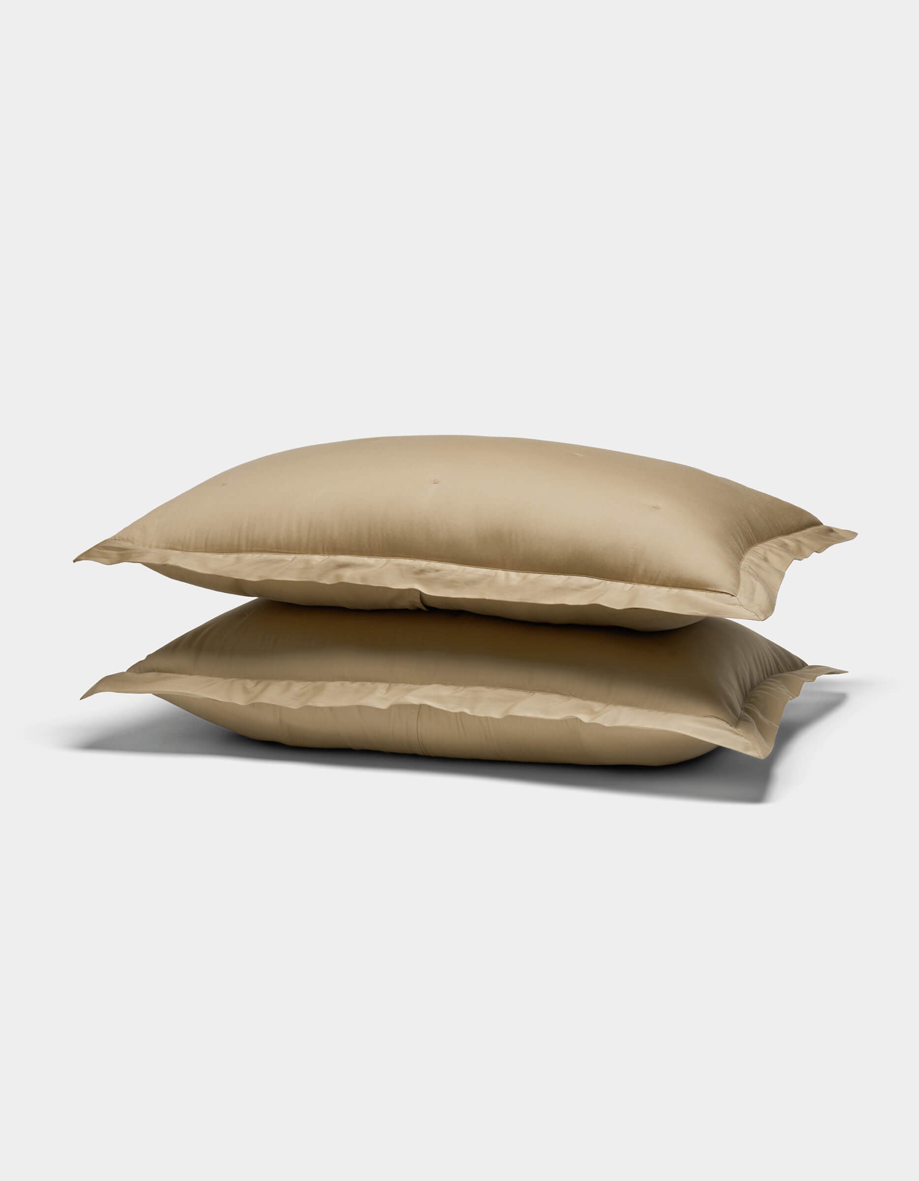 Two Cozy Earth Soft-Wash Cotton Quilted Shams, in beige, are stacked on top of each other against a plain white background.|Color:Sandalwood