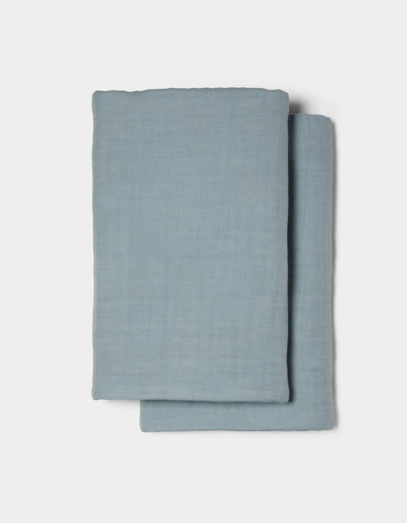 Two neatly folded Waterfront Shams by Cozy Earth are stacked on a plain white background.