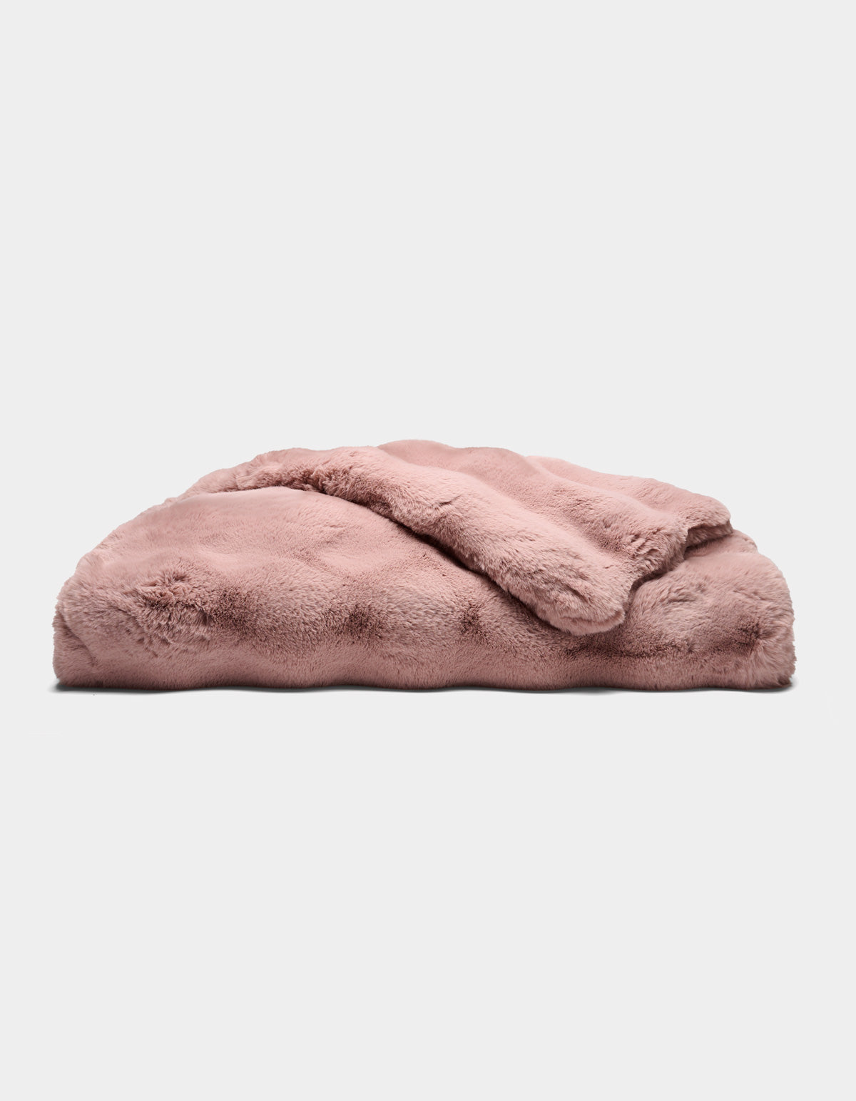 The Cozy Earth Double Bubble Cuddle Blanket, in plush light pink, is neatly folded and displayed on a flat surface against a plain white background.|Color:Viola