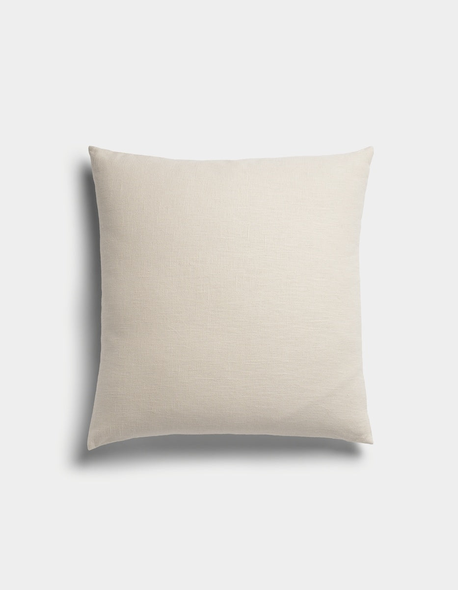 The Sonoma Throw Pillow by Cozy Earth features a square shape and light beige color with a smooth fabric texture, displayed against a plain white background.