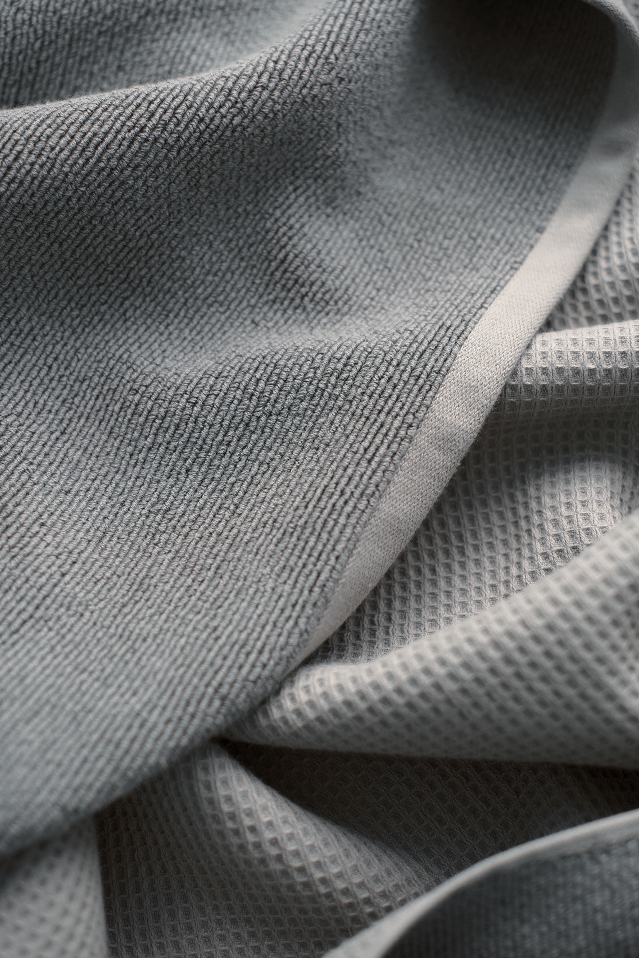 Waffle Bath Towel in the color Charcoal. Photo of Charcoal Waffle Bath Towel taken close up showing only the Charcoal. |Color:Charcoal