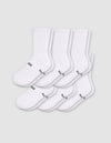 Six pairs of Cozy Earth Men's Essential Calf Socks in white are arranged in two rows on a light gray background, each featuring small black text and a symbol near the toes and ribbed cuffs.|Color:White