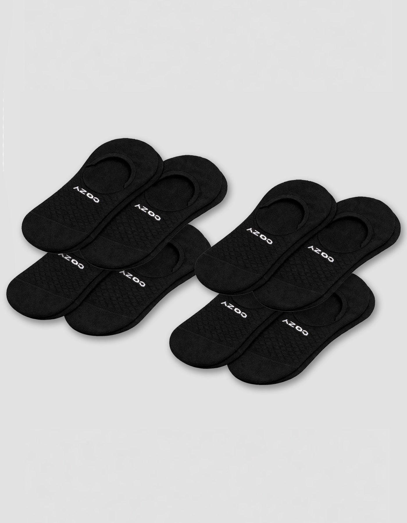Eight pairs of black Cozy Earth Essential No-Show Socks are displayed in two rows on a plain background, featuring a low-cut design with the brand name near the heel.|Color:Black