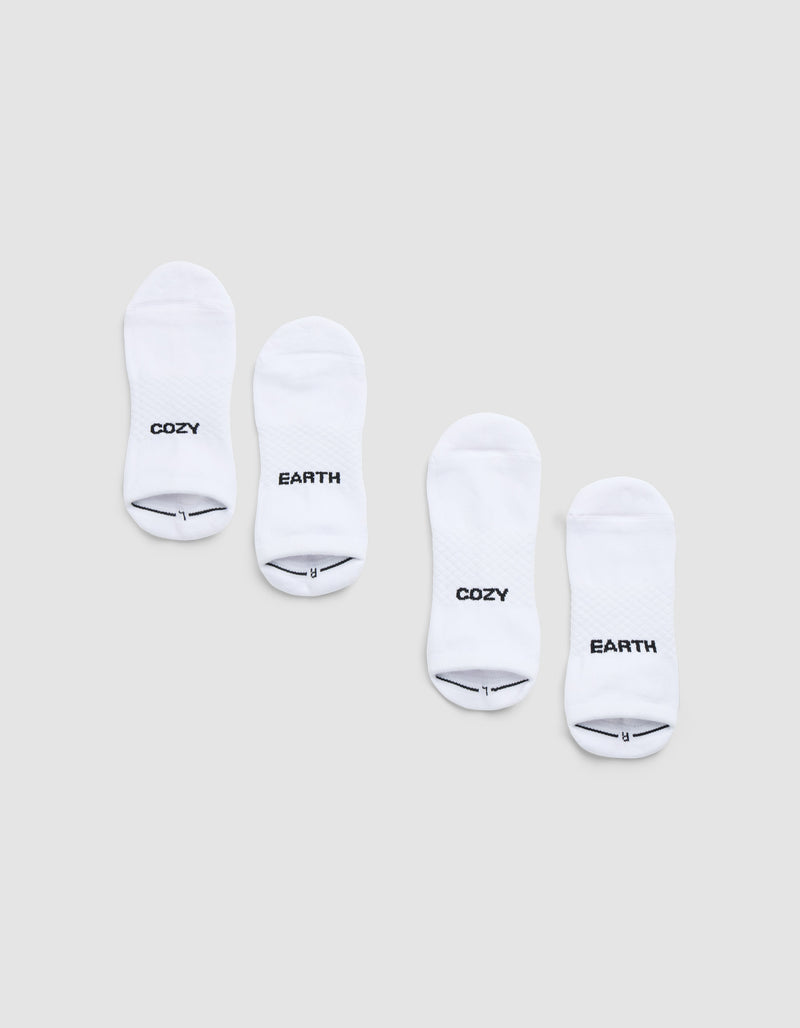 Two pairs of Cozy Earth Essential Ankle Socks are displayed side by side on a light gray background, each featuring black text near the toes—one in each pair reads "COZY" and the other reads "EARTH.