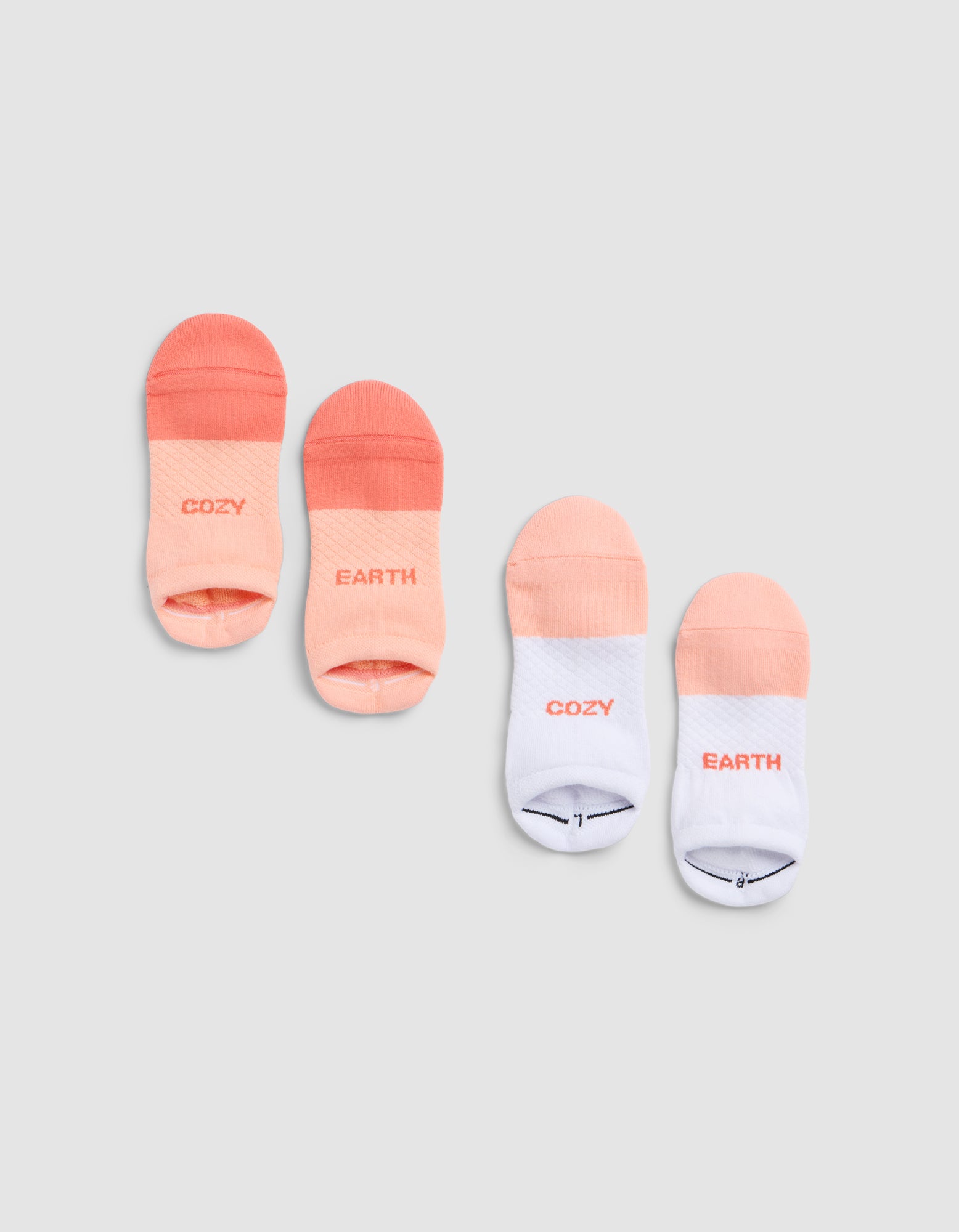 Four Essential Ankle Socks by Cozy Earth, in peach and white gradients, are paired on a light gray background. Each pair shows "COZY EARTH" or "EARTH"/"COZY" in soft gradient lettering. |Color:Cantaloupe