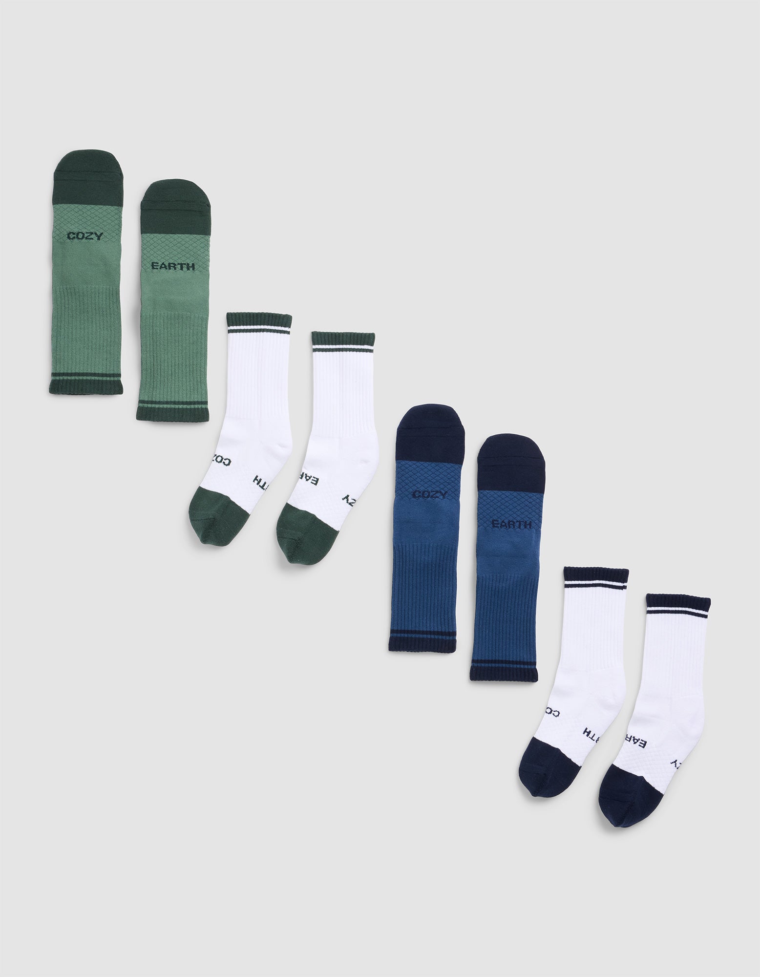 Five pairs of Cozy Earth Essential Calf Socks displayed in a row on a light background, featuring green, white with green accents, blue, blue with navy accents, and white with navy accents.|Color:Spruce/Eclipse