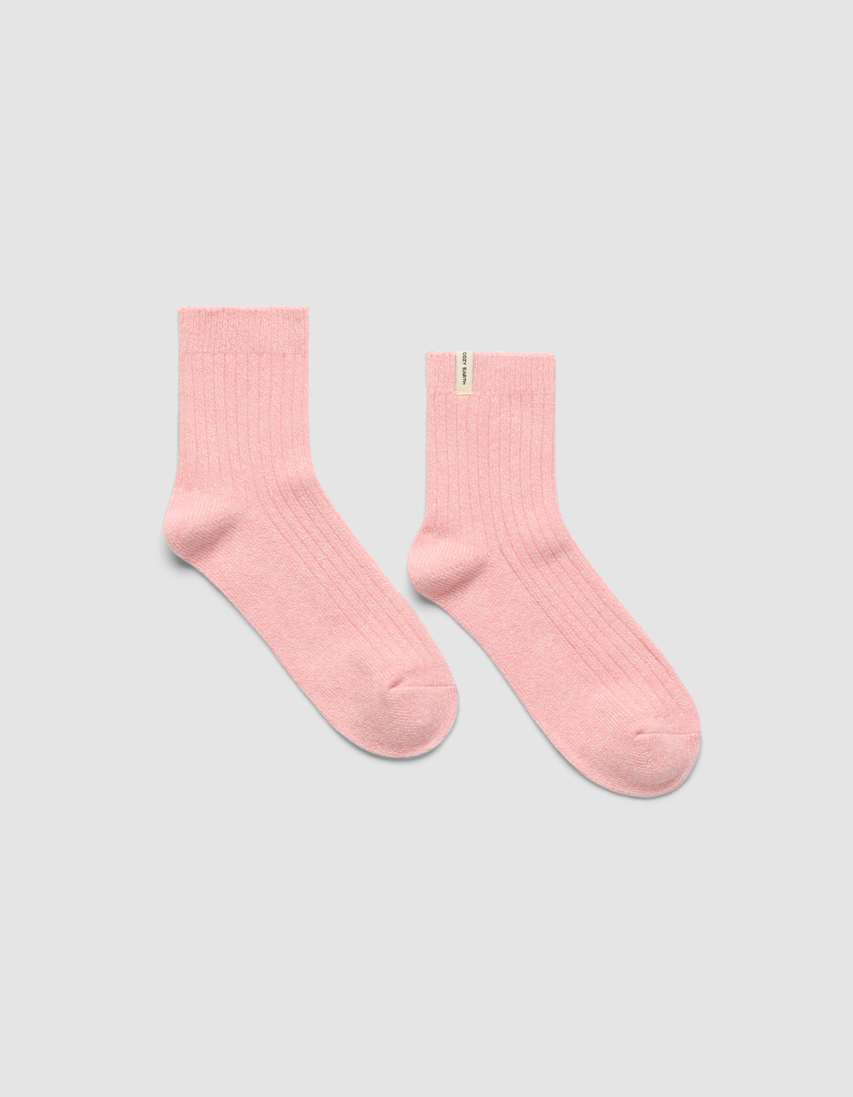 A pair of The Plush Modern Crew Sock in pink by Cozy Earth.|Color:Tulip