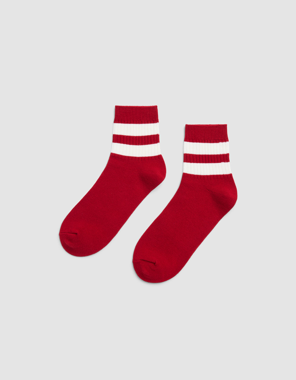 A pair of Cozy Earth Women's Sadie Socks in Crimson/Bone, featuring two thick white stripes by the cuffs, displayed side by side on a plain light gray background.|Color:Crimson/Bone