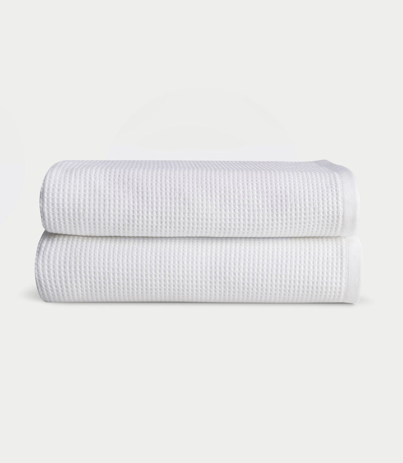 Waffle Bath towels in the color White. Photo of white Waffle Bath towels taken with white background.
