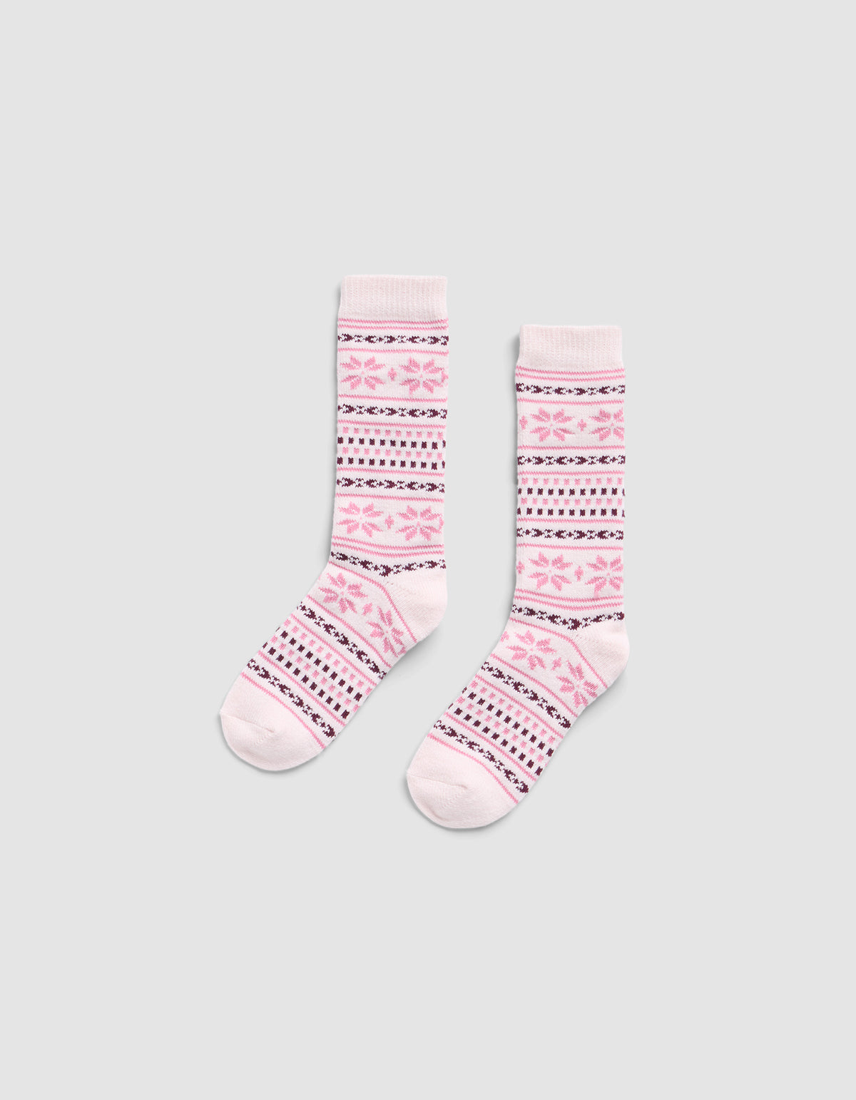 The Snowflake Plush Lounge Sock by Cozy Earth is a pair of pink crew socks with pink, purple, and white horizontal stripes and floral motifs, displayed on a light gray background.|Color:Ballet