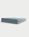 A neatly folded, light blue Cozy Earth Waffle Bath Towel is displayed on a white background. |Color:Brook