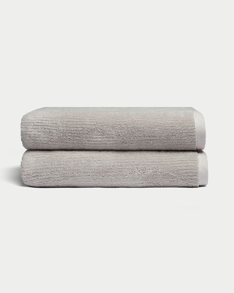 Ribbed Terry Bath Towels in the color Light Grey. Photo of Light Grey Waffle Bath Towels taken with white background.
