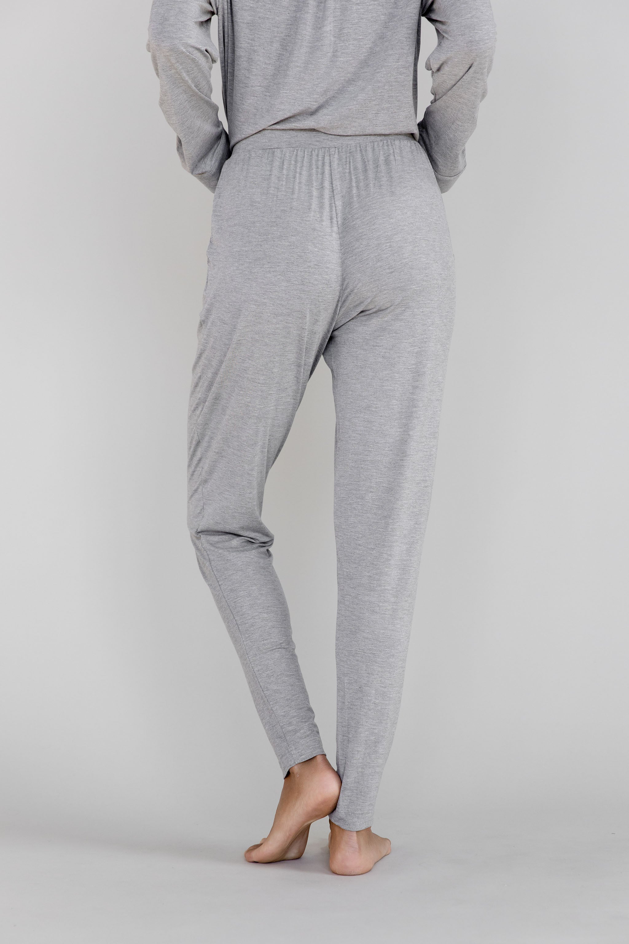 Gray Cozy Earth Stretch Knit Tapered Pant set worn by a person facing backward on a light gray background |Color:Heather Grey