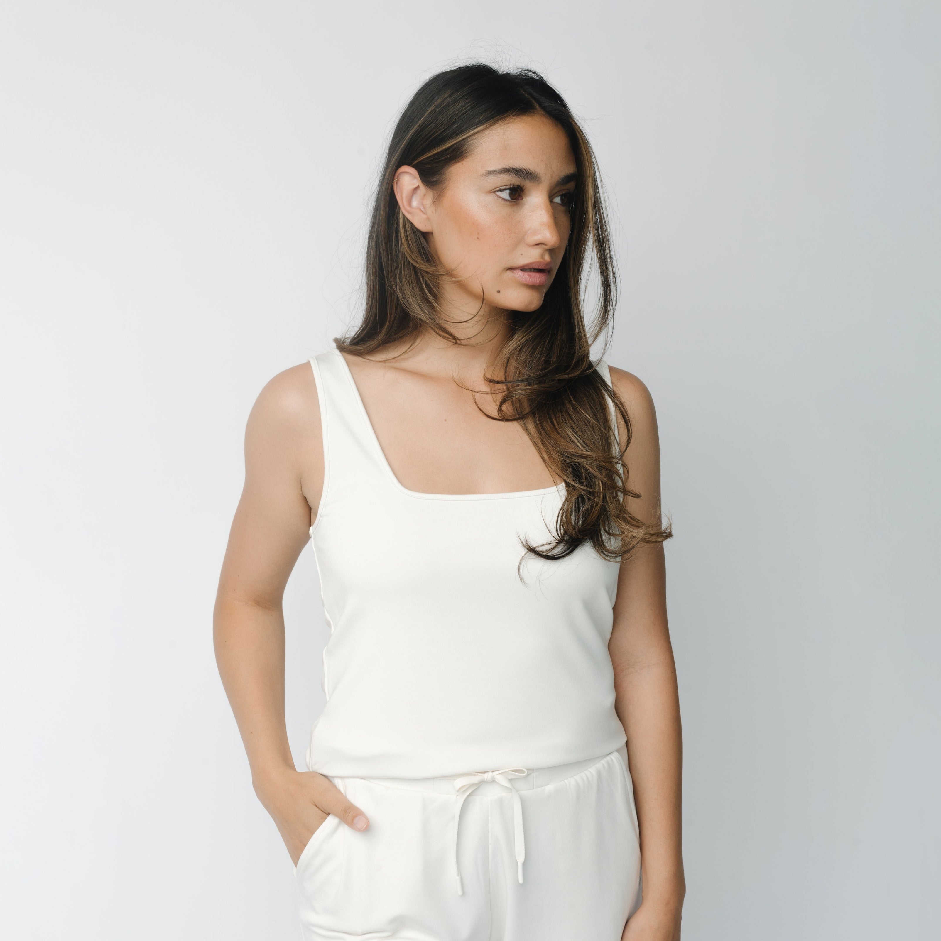 Woman wearing Ivory Women’s Ultra-Soft Bamboo Square Neck Tank in front of a white background |Color:Ivory