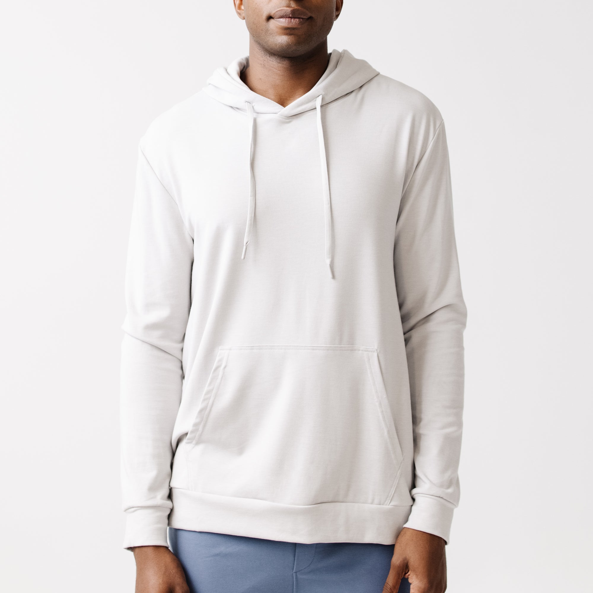 Light Grey Bamboo Hoodie worn by man standing in front of white background.