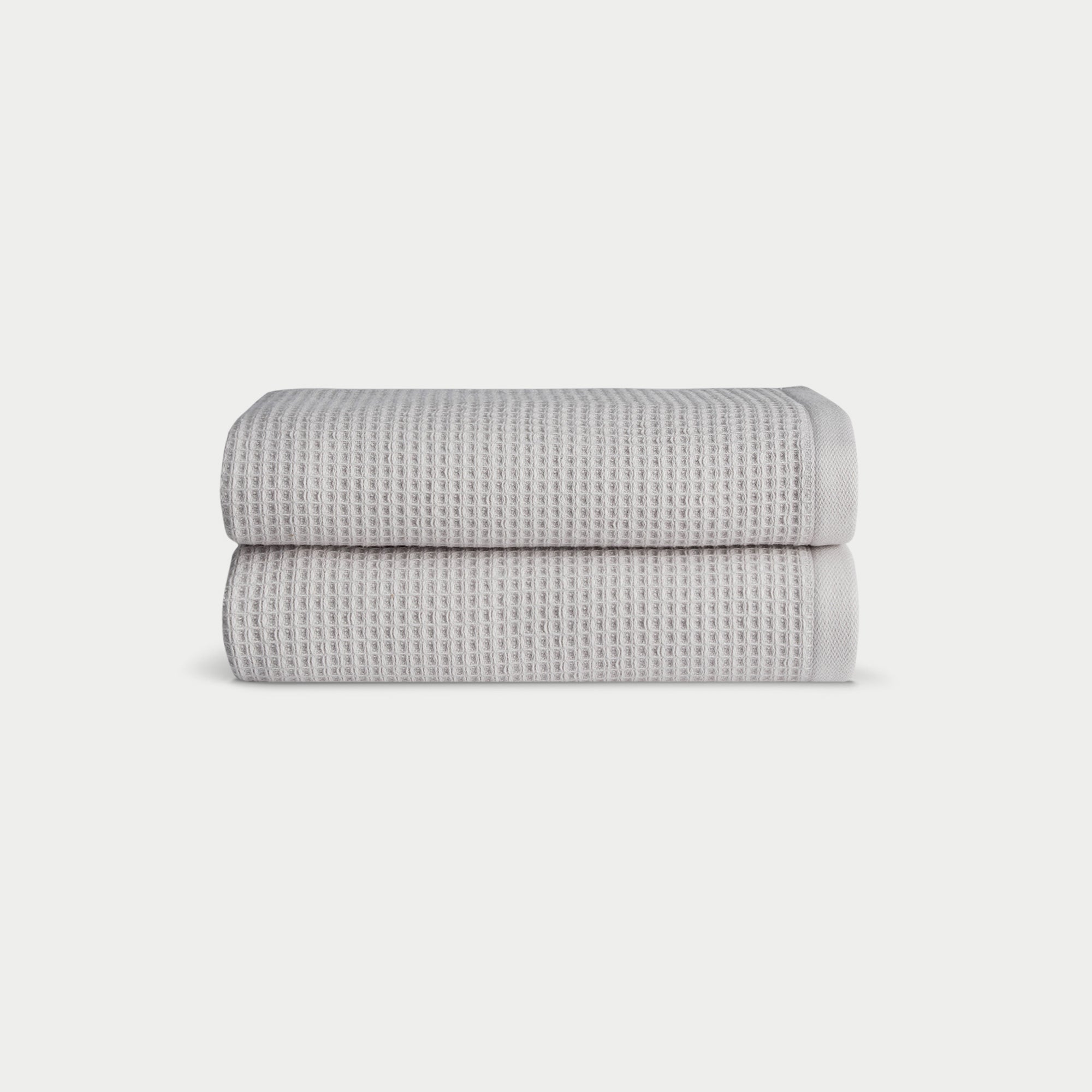 Light Grey Waffle Hand Towel set neatly folded. The photo was taken with a white background. |Color:Light Grey